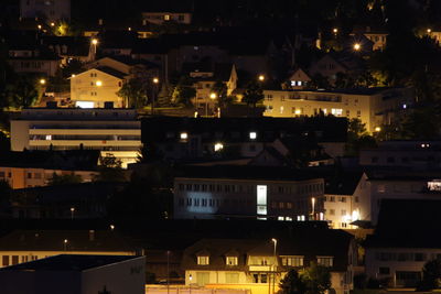 High angle view of illuminated buildings in city
