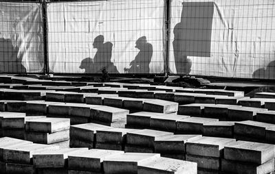 Shadow of people sitting on staircase