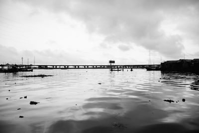 Bridge over sea against sky