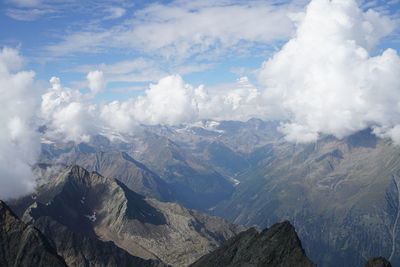 Aerial view of snowcapped mountains against sky