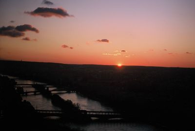 Scenic view of sea against orange sky