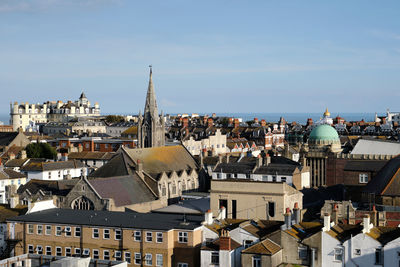 Buildings in city against sky