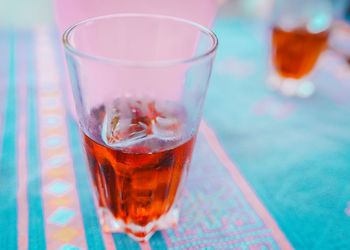 Close-up of red drink on table