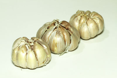 Close-up of garlic against white background