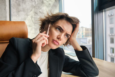 Young woman using mobile phone