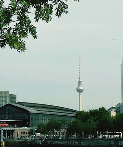 Low angle view of communications tower against sky