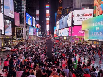 Crowd on city street at night