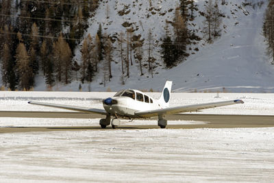 A private jet landing in the engadine airport in st moritz in winter