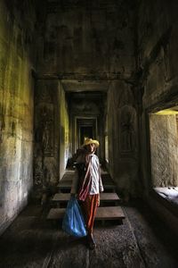 Woman in corridor of building