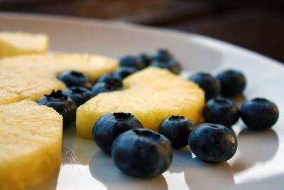 Close-up of fresh fruits in plate on table