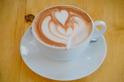 High angle view of cappuccino on table