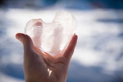 Close-up of hand holding ice cream