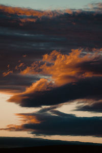 Low angle view of dramatic sky during sunset