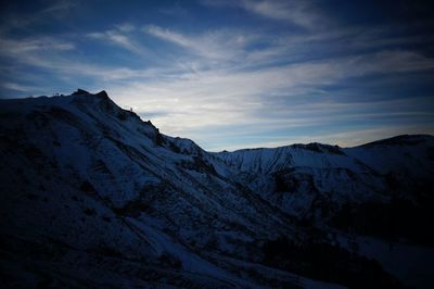 Scenic view of snowcapped mountain against sky
