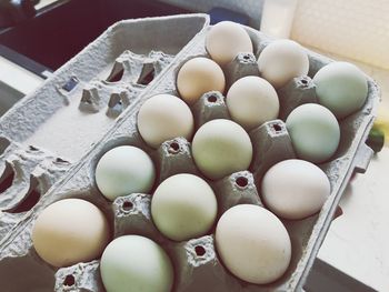 High angle view of eggs in carton