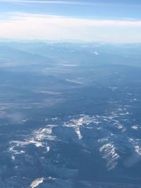 Aerial view of landscape and sea against sky