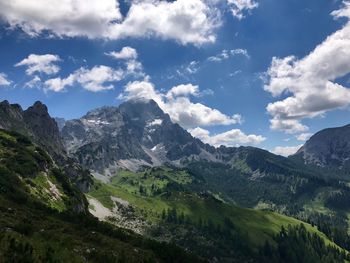 Scenic view of mountains against cloudy sky