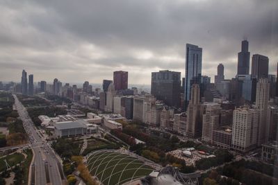 High angle view of cityscape against cloudy sky