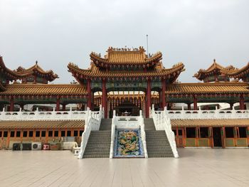 Temple outside building against sky