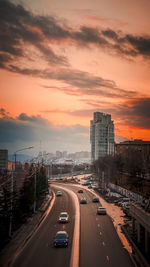 Traffic on highway at sunset