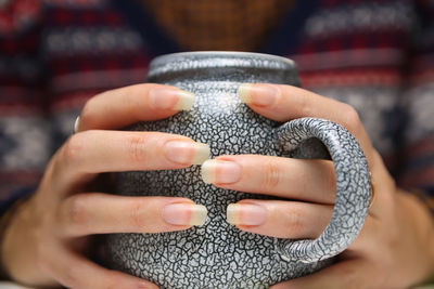 Close-up of person holding hands