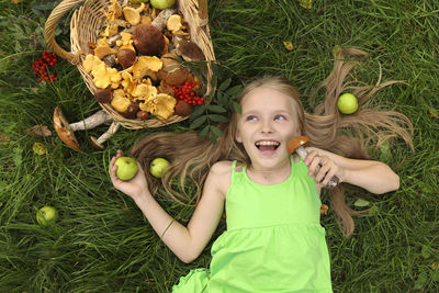 Portrait of happy girl eating food