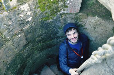 High angle portrait of man in spiral staircase