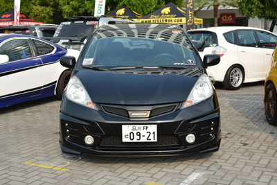 Cars parked on road in city