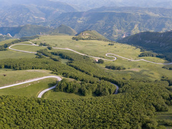 High angle view of winding road on landscape