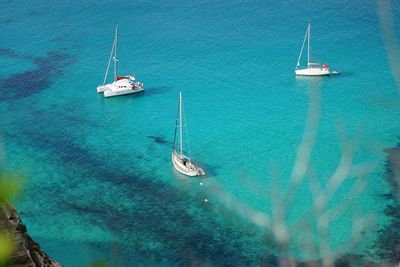 High angle view of boats in calm blue sea