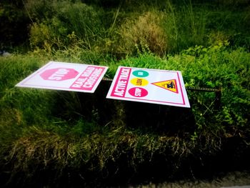 High angle view of information sign on field
