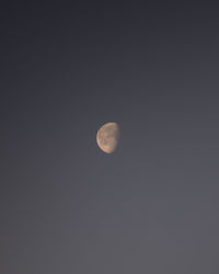 Low angle view of moon against sky at night