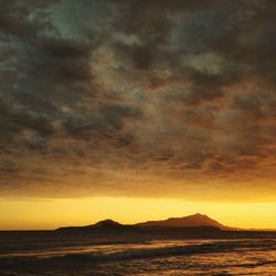 Scenic view of sea at sunset