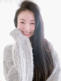 Portrait of a smiling young woman in snow