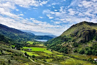 High angle view of countryside lake against mountain range