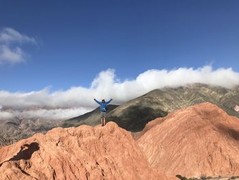 Scenic view of mountains against blue sky