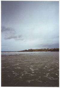 Scenic view of beach and sea against sky