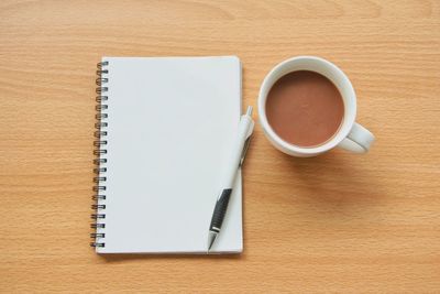 High angle view of coffee cup on table