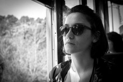 Portrait of young woman wearing sunglasses