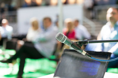 Close-up of people on table