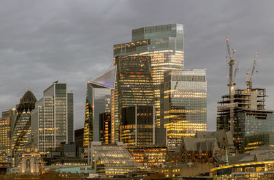 Illuminated buildings in city at night