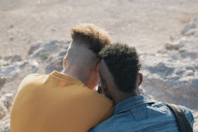 Rear view of couple on beach