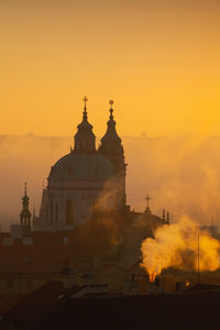 Historic building against sky during sunset