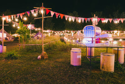 Illuminated lighting equipment on field at night