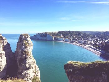 Panoramic view of bay against clear blue sky