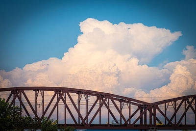 Low angle view of bridge against blue sky