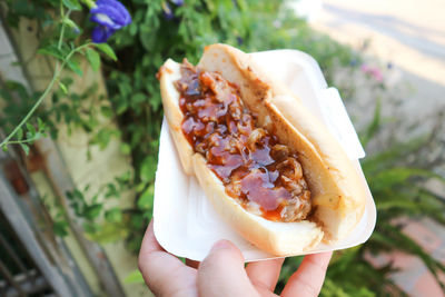 Cropped hand holding food