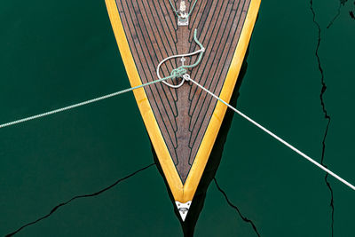 High angle view of ropes tied to boat on lake