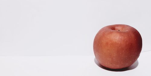 Close-up of apple against white background