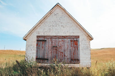 House on field against sky